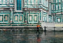 장마철 대비 면역력 강화 운동법 person holding umbrella walking on road