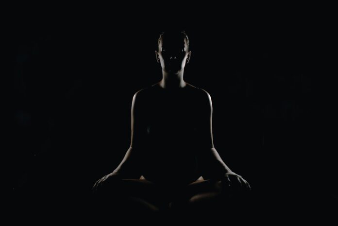 Photo by Max person doing meditation pose